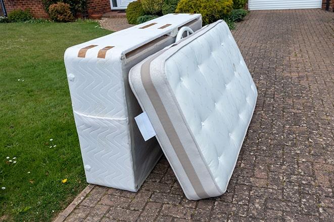 mattress being disposed of by a professional removal team